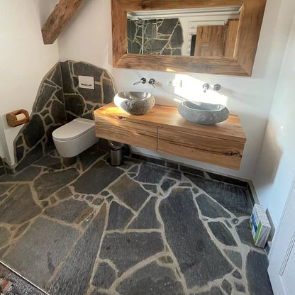 Natural stone slabs as wall and floor covering in the bathroom, Deep Sea quartzite polygonal slabs