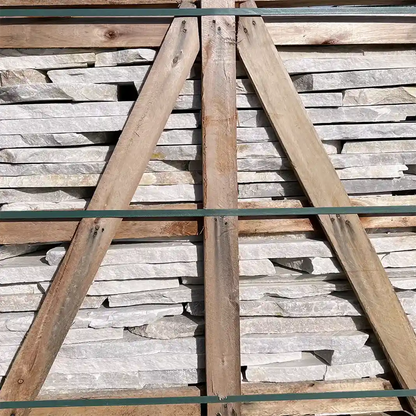 stacked white rubble stone slabs